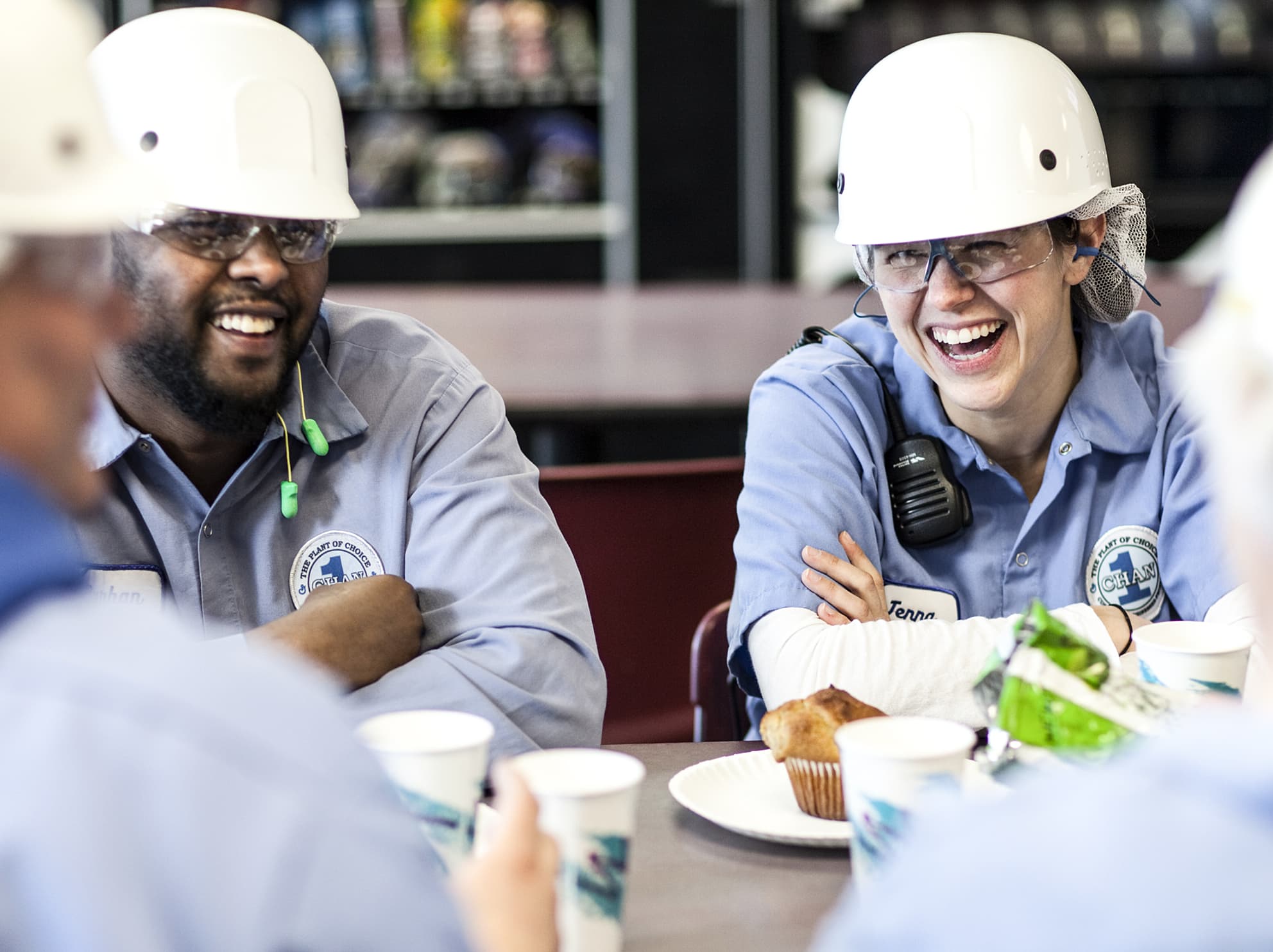 General Mills employees smiling at lunch table